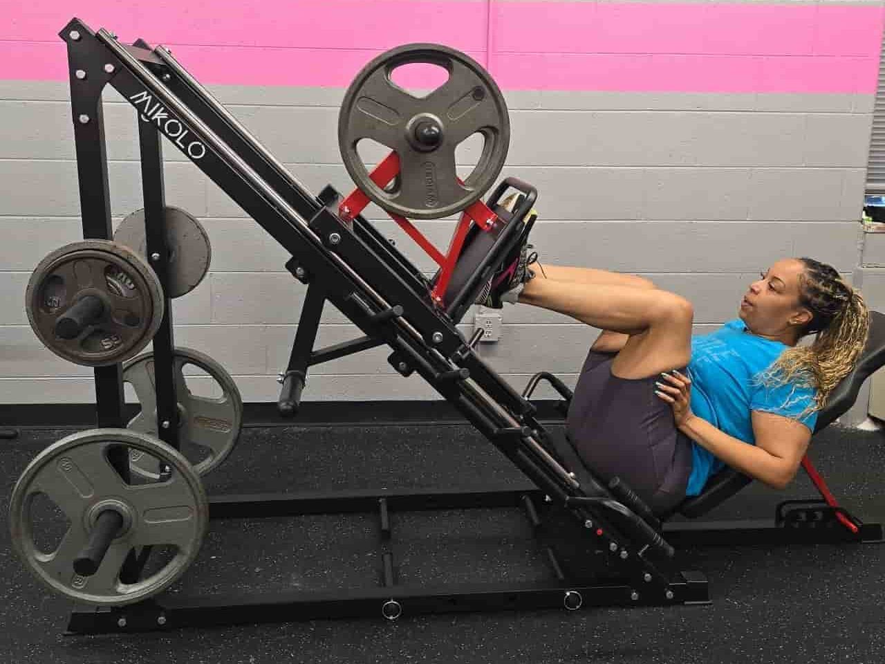 Glatter Fitness client performing a leg press exercise to build lower body strength and muscle mass.