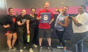 Glatter Fitness coach and five members celebrating a 500-workout milestone, showcasing community and commitment at the Richmond gym.